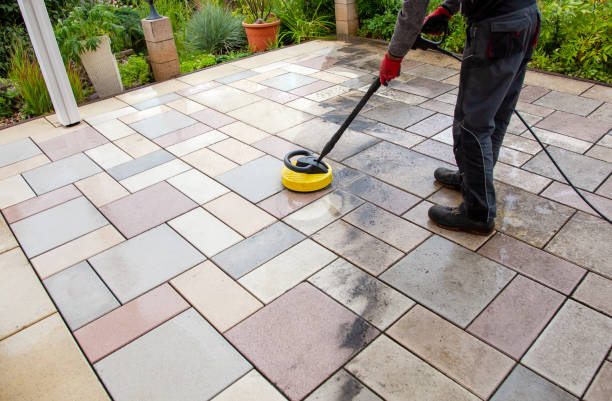 worker cleaning the outdoors floor.