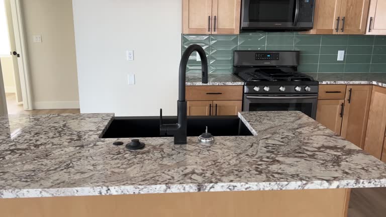 Inside new construction kitchen with newly installed cabinets and beautiful kitchen island.